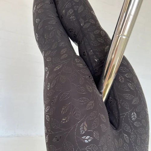 woman’s legs grabbing a pole wearing EnviroCo’s Sticky Grippy Leggings