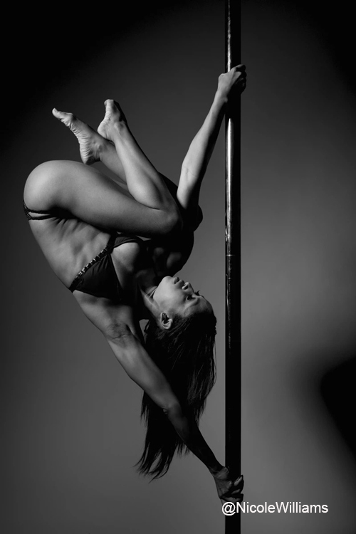 Nicole ThePole performs an aerial trick